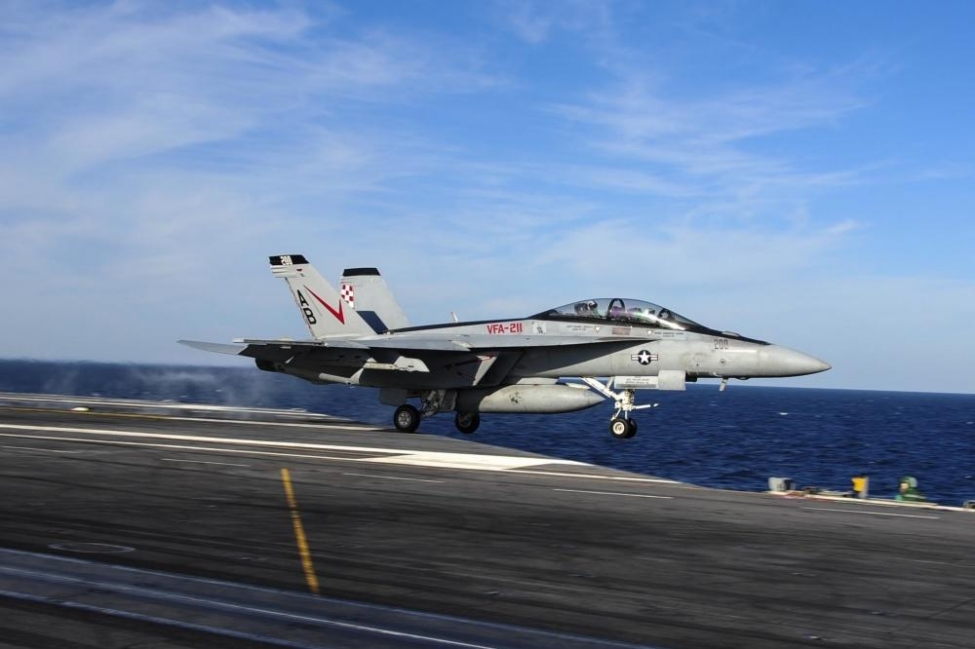 An F/A-18F Super Hornet assigned to the Checkmates of Strike Fighter Attack Squadron (VFA) 211 is launched off the flight deck of the aircraft carrier USS Theodore Roosevelt in 2014. 