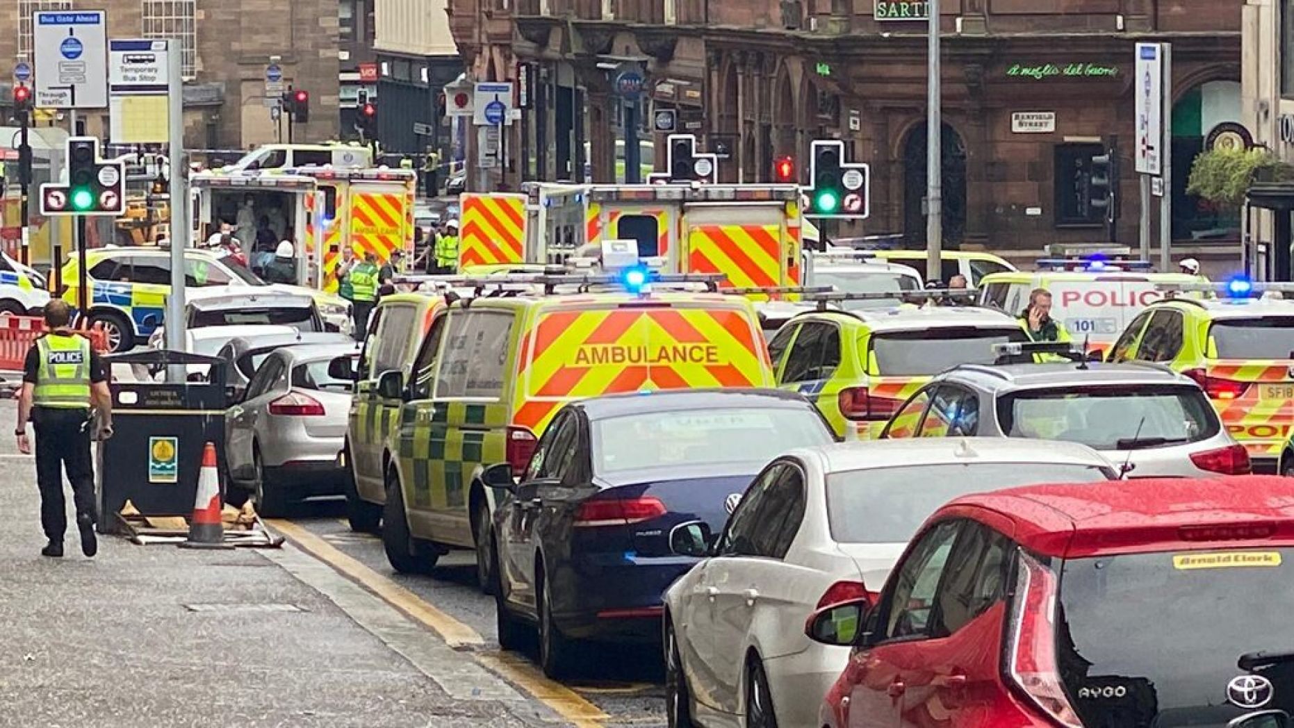 Emergency responders are seen near a scene of reported stabbings, in Glasgow, Scotland, Britain June 26, 2020,