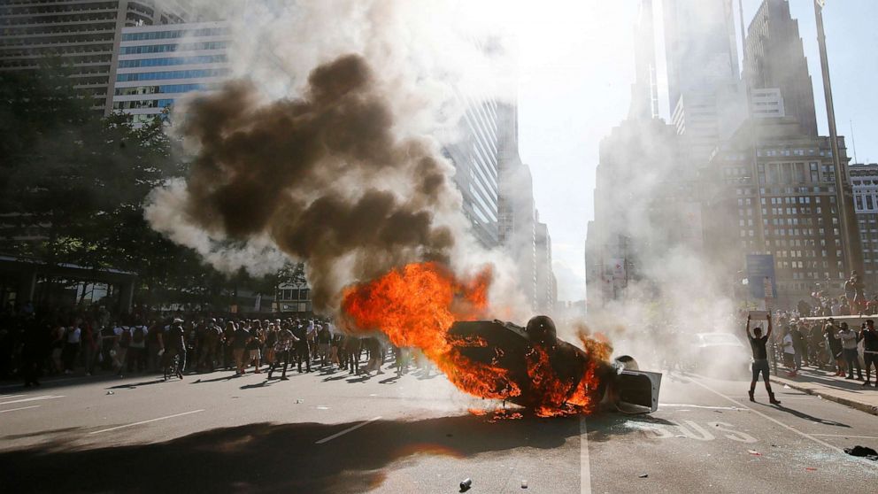 Smoke rises from a fire engulfing a police cruiser in Center City during the "Justice for George Floyd" protest, May 30, 2020, in Philadelphia.Smoke rises from a fire engulfing a police cruiser in Center City during the "Justice for George Floyd" protest, May 30, 2020,