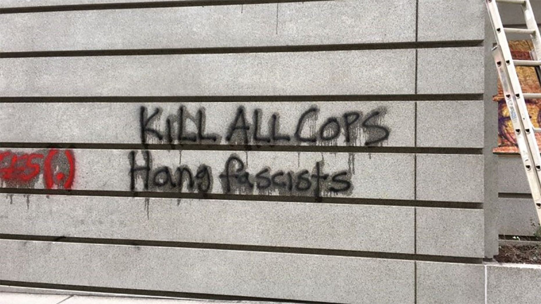 Anti-cop graffiti reading “Kill All Cops" was found on a Portland building during a demonstration that turned violent on Saturday, 