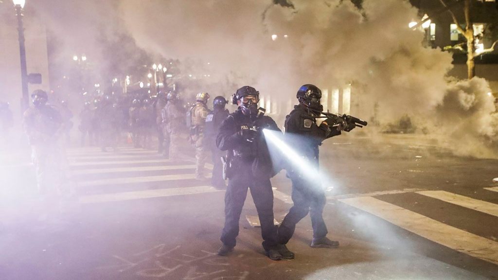 Federal officers deploy tear gas and crowd control munitions at demonstrators during a Black Lives Matter protest at the Mark O. Hatfield United States Courthouse Tuesday, July 28, 2020,