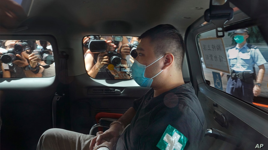 Tong Ying-kit, 23, arrives at a court in a police van in Hong Kong, July 6, 2020.