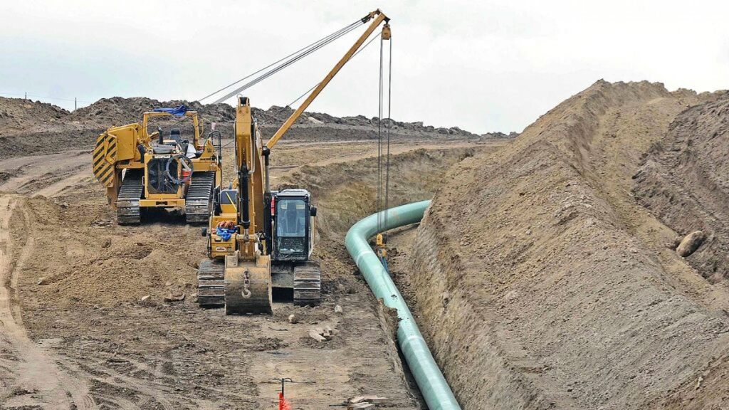 In this Oct. 5, 2016, file photo, heavy equipment is seen at a site where sections of the Dakota Access pipeline,