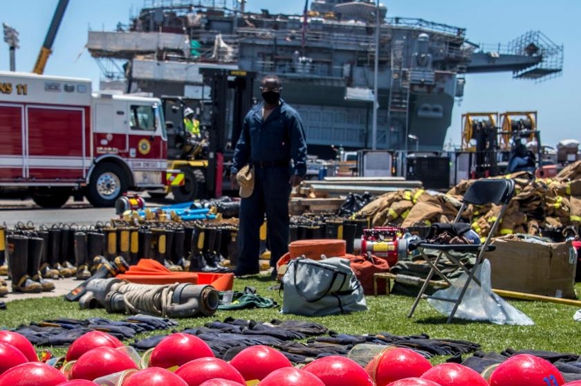Fire crews on the USS Bonhomme Richard were still fighting Thursday to contain a blaze that broke out on Sunday.