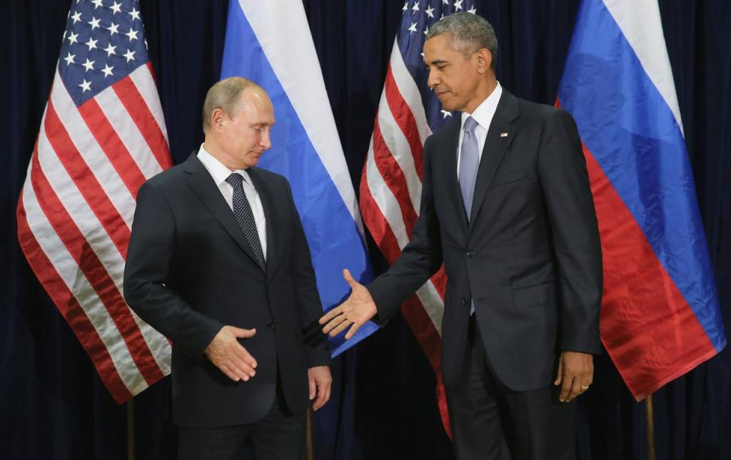 President Obama and Russian leader Vladimir Putin shake hands in 2015.