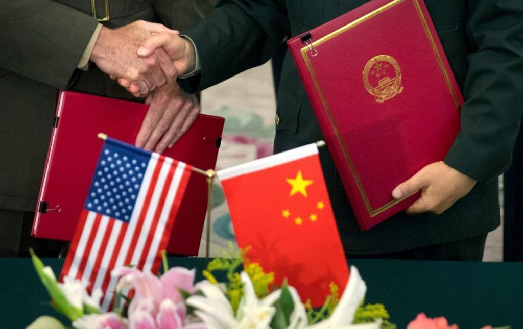 Gen. Joseph Dunford chairman of the U.S. Joint Chiefs of Staff, and Chief of the General Staff of the Chinese People's Liberation Army Gen. Fang Fenghui shake hands,