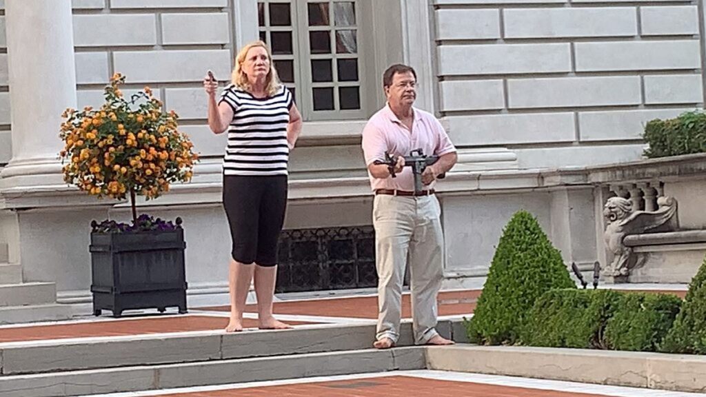 Mark and Patricia McCloskey drawing their firearms on the crowd marching toward St. Louis Mayor Lyda Krewson's home last month.