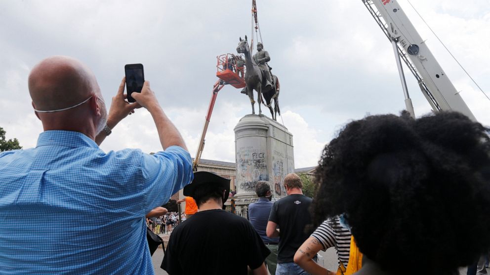 Work crews remove the statue of confederate general Stonewall Jackson, Wednesday, July 1, 2020, in Richmond, Va.