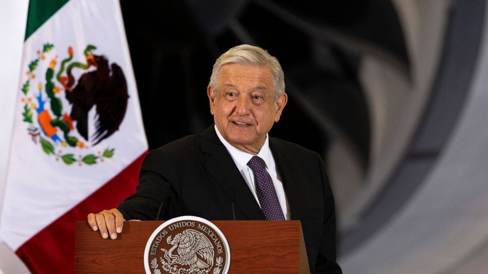 Mexican President Andres Manuel Lopez Obrador gives his daily, morning press conference in front of the former presidential plane at Benito Juarez International Airport in Mexico City, Monday, July 27, 2020. 