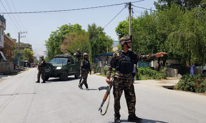 Afghan security forces arrive at an area where explosions and gunshots were heard, in Jalalabad city, Afghanistan, on July 28, 2018. 