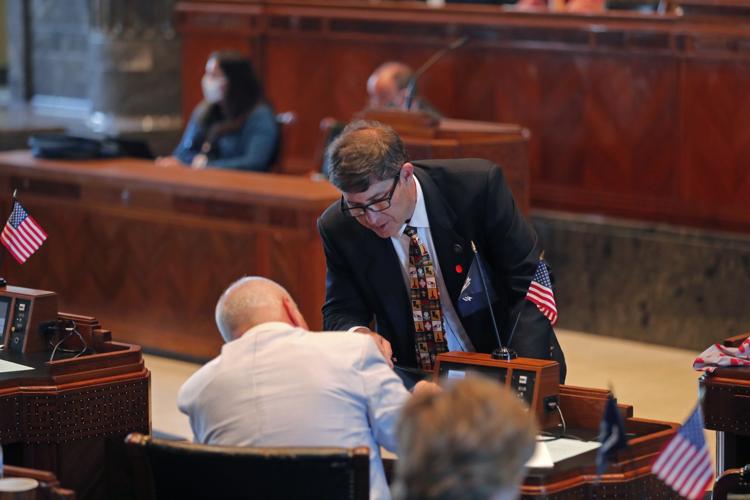 State Sen. Kirk Talbot, R-River Ridge, talks with Sen. Jay Morris, R-Monroes, as the Senate convenes in the Senate chamber in Baton Rouge, La., Monday, May 4, 2020.