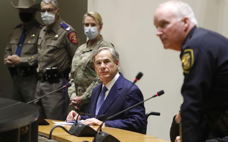 Texas Gov. Greg Abbott, center, and others look on as Fort Worth Police Chief Ed Krauss, right, speaks during a news conference at city hall in Dallas, Tuesday, June 2, 2020.