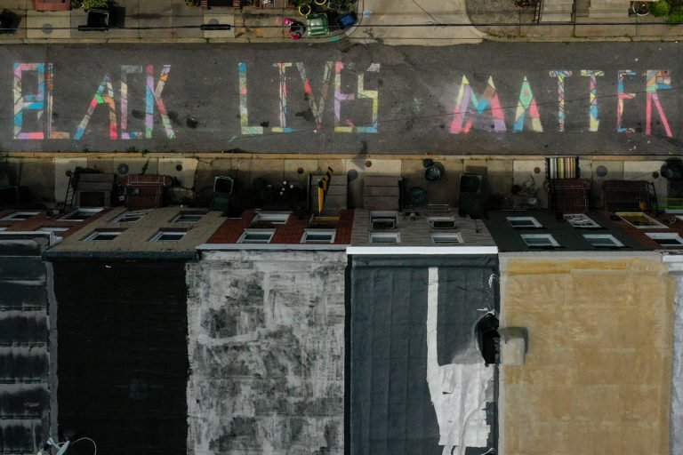 BALTIMORE, MARYLAND – JUNE 16: In an aerial image from a drone, a ‘Black Lives Matter’ mural chalk painting is seen on the 300 block of South Madeira Street on June 16, 2020 in Baltimore, Maryland.
