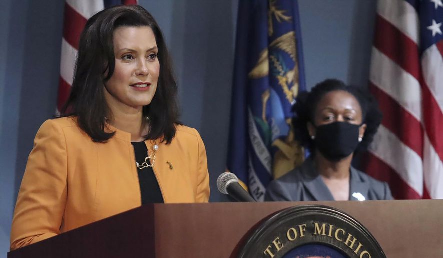 Gov. Gretchen Whitmer addresses the state during a speech in Lansing, Mich.