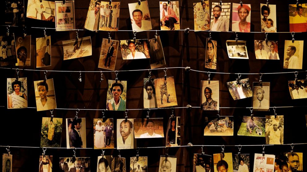 In this Friday, April 5, 2019 file photo, family photographs of some of those who died hang on display in an exhibition at the Kigali Genocide Memorial centre in the capital Kigali, Rwanda.