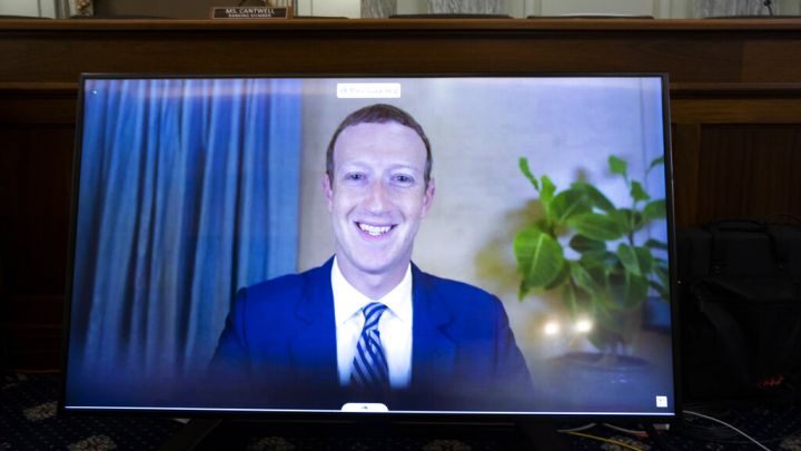 Facebook CEO Mark Zuckerberg appears on a screen as he speaks remotely during a hearing before the Senate Commerce Committee on Capitol Hill, Wednesday, Oct. 28, 2020,