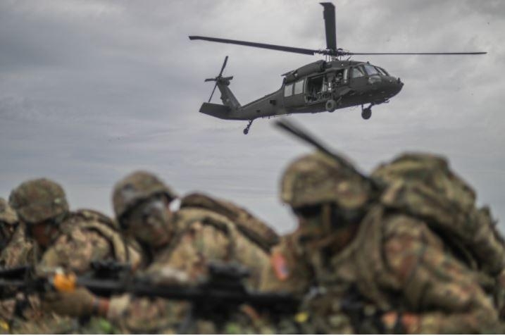 Pictured, members of the U.S. Army's 2nd Cavalry Regiment practice an air assault exercise.