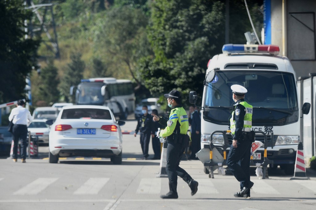 Police are pictured outside the Yantian District Detention Centre, where 12 Hong Kong pro-democracy activists have been detained after they were arrested last August ,