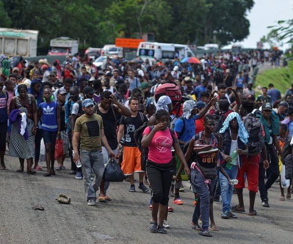 Migrants walk down Highway 200 en route to Huixtla near Tapachula, Chiapas state, Mexico, Saturday Oct. 12, 2019.