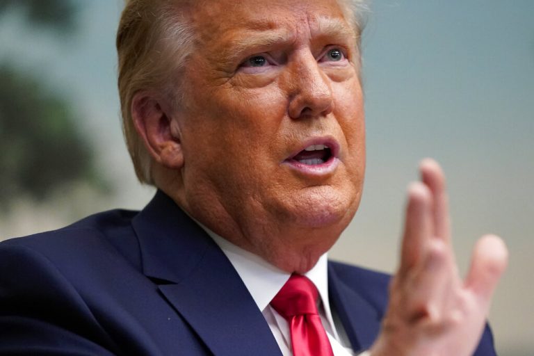 President Donald Trump speaks with reporters after participating in a video teleconference call with members of the military on Thanksgiving, Thursday, Nov. 26, 2020, at the White House in Washington.