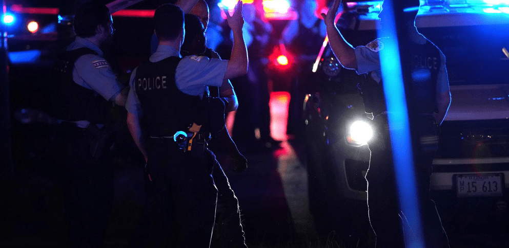 Police secure a crime scene in Chicago. (E. Jason Wambsgans/Chicago Tribune/TNS)