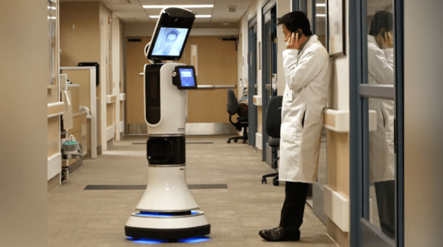 Dr. Alan Shatzel, medical director of the Mercy Telehealth Network, is displayed on the monitor RP-VITA robot as he waits to confer with Dr. Alex Nee at Mercy San Juan Hospital in Carmichael, Calif.