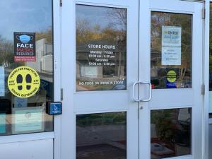 A thrift store in Reotown posts signs notifying customers of a statewide mask mandate that's being challenged in court.