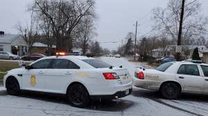 Indianapolis Metropolitan Police Department work the scene Sunday, Jan. 24, 2021, in Indianapolis where five people, including a pregnant woman, were shot to death early Sunday inside an Indianapolis home.