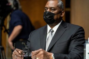 Retired Gen. Lloyd Austin prepares to testify before the Senate Armed Services Committee during his confirmation hearing to be the next secretary of defense, in Washington on Jan. 19, 2021.
