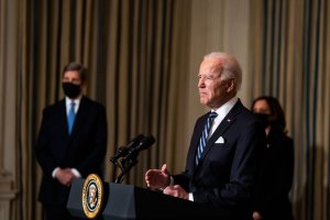 President Joe Biden, flanked by climate czar John Kerry and Vice President Kamala Harris, delivers remarks on his administration's response to climate change at a White House event Wednesday. Pool Photo by Anna Moneymaker/UPI