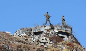 Indian Army personnel stand guard at Bumla pass at the India-China border in Arunachal Pradesh on Oct. 21, 2012.