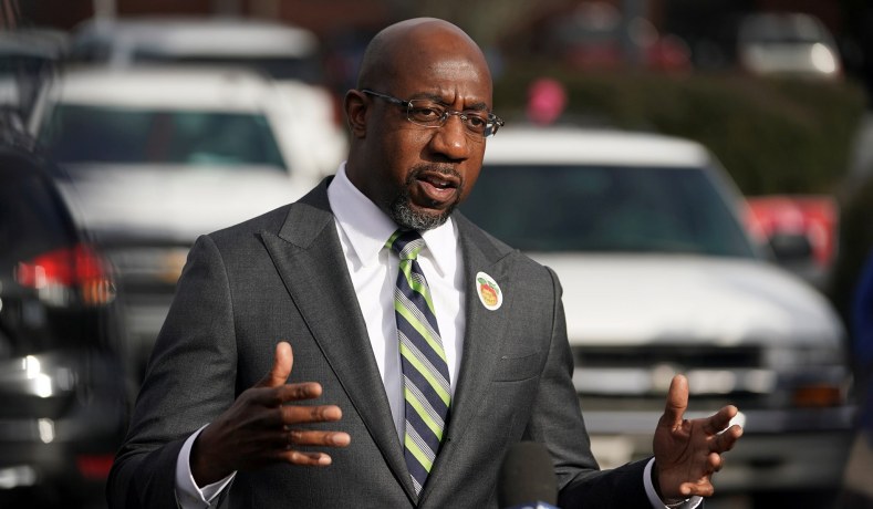 Democratic Senate candidate Raphael Warnock speaks to the media as early voting in two run-off elections begins in Atlanta, Ga., December 14, 2020.