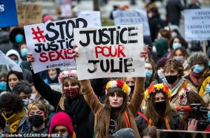Pictured: Dozens of people gathered on February 7 in Paris to demand 'Justice for Julie'. Ten years ago, Julie, 13 years old, was raped by about twenty firemen in a Parisian fire station.