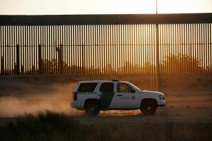 A US Customs and Border Protection vehicle patrols a new section of the border wall in El Paso, Texas, as seen from Ciudad Juarez, Mexico, on August 27, 2020.