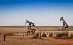 Oil pumps and hay bales in rural Oklahoma.

Richard G Smith / Shutterstock.com
