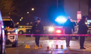 Chicago and Evanston police investigate a crime scene after a gunman went on a shooting spree before being killed by police during a shootout in Evanston, Ill.,