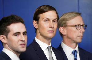 White House adviser Jared Kushner, flanked by aide Avi Berkowitz (L) and Brian Hook, former U.S. envoy to Iran, during a press briefing on the agreement between Israel and the United Arab Emirates at White House in Washington.