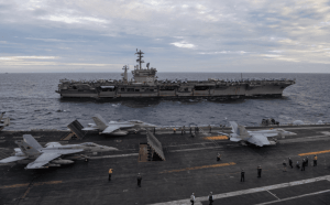 An F/A-18E Super Hornet launches from USS Theodore Roosevelt (CVN 71) in the South China Sea.