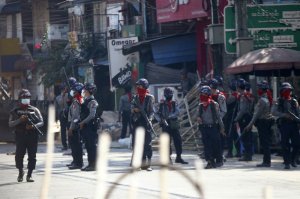 Armed police stand guard on a major street to preven anti-coup demonstration in Yangon, Myanmar, Friday, March 5, 2021. Footage of a brutal crackdown on protests against a coup in Myanmar has unleashed outrage and calls for a stronger international response.
