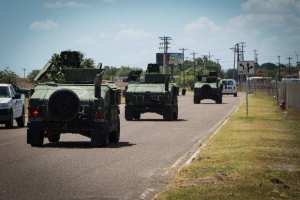 Texas National Guard vehicles depart to the Texas-Mexico border in 2014.