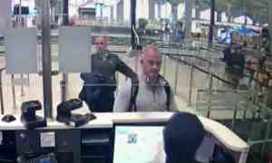 This image from security camera video shows Michael Taylor, center, and George-Antoine Zayek at passport control at Istanbul airport in Turkey.