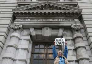  Karen Shore holds up a sign outside the U.S. 9th Circuit Court of Appeals. (Jeff Chiu/Associated Press)