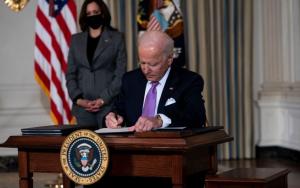 Vice President Kamala Harris looks on as U.S. President Joe Biden signs executives orders
(Doug Mills-Pool / Getty Images)