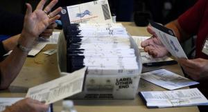 Election workers in Chester County, Pa., process mail-in and absentee ballots for the 2020 general election on Nov. 4. (Matt Slocum/AP Photo)