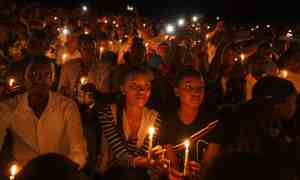 A candlelit vigil during a memorial service in 2019 to mark 25 years since the genocide, at Amahoro stadium in Kigali, Rwanda.
