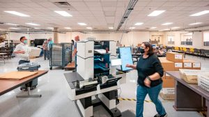 Poll workers count ballots inside the Maricopa County Election Department in Phoenix, Ariz., on Nov. 5, 2020.