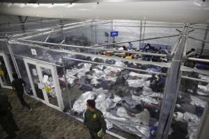 FILE - In this March 30, 2021 file photo, minors lie inside a pod at the Donna Department of Homeland Security holding facility,