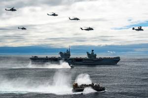 US Navy and Marine Corps aircraft over HMS Queen Elizabeth and a US Navy landing craft, air cushion during a photo exercise, May 17, 2021