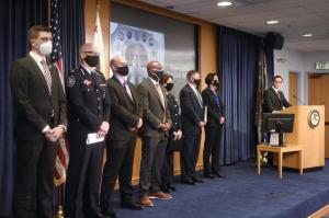 Acting U.S Attorney Randy Grossman, right, speaks as law enforcement officials look on during a news conference announcing Operation Trojan shield, Tuesday, June 8, 2021, in San Diego.