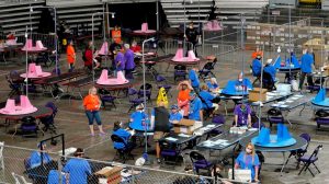 Contractors working for Florida-based company, Cyber Ninjas, which was hired by the Arizona Senate, audit ballots at Veterans Memorial Coliseum in Phoenix, Ariz.,